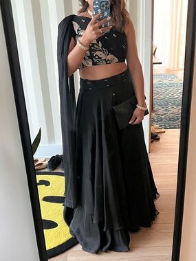 Isha Gupta Tayal Black Crepe Layered Lehenga Set with Embroidered Blouse